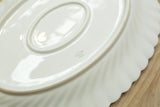 Two vintage white porcelain oval serving plates