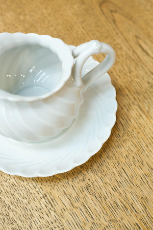 Vintage white porcelain milk jug and saucer