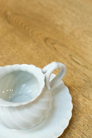 Vintage white porcelain milk jug and saucer