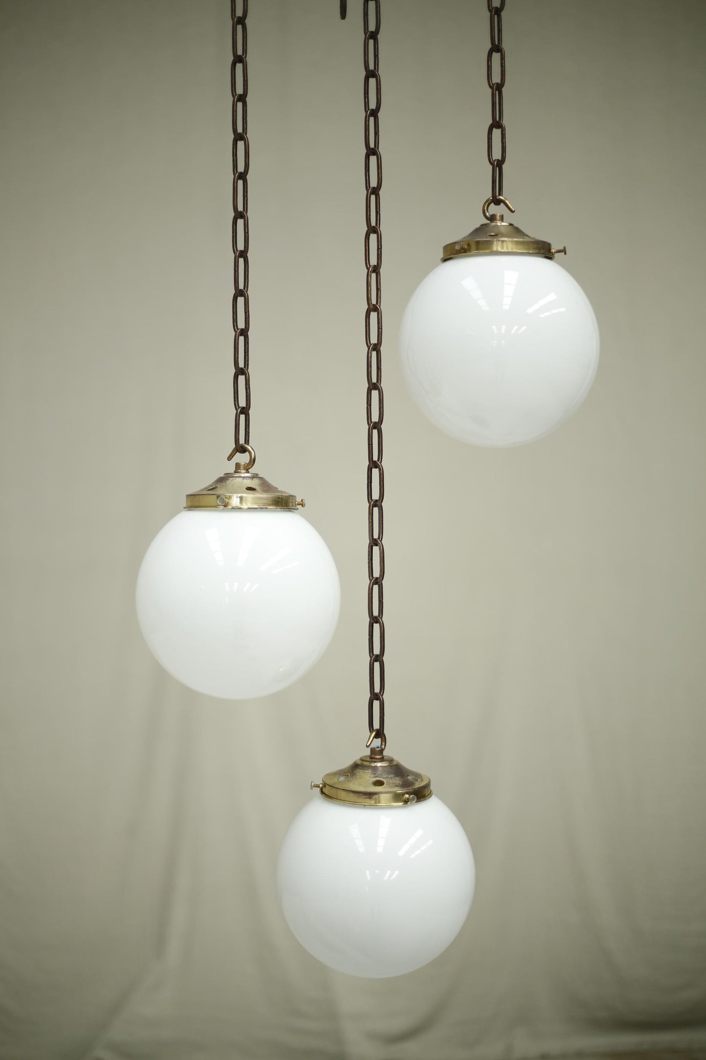 Huge run of 20th century small opaline globe pendant lights