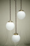 Huge run of 20th century small opaline globe pendant lights