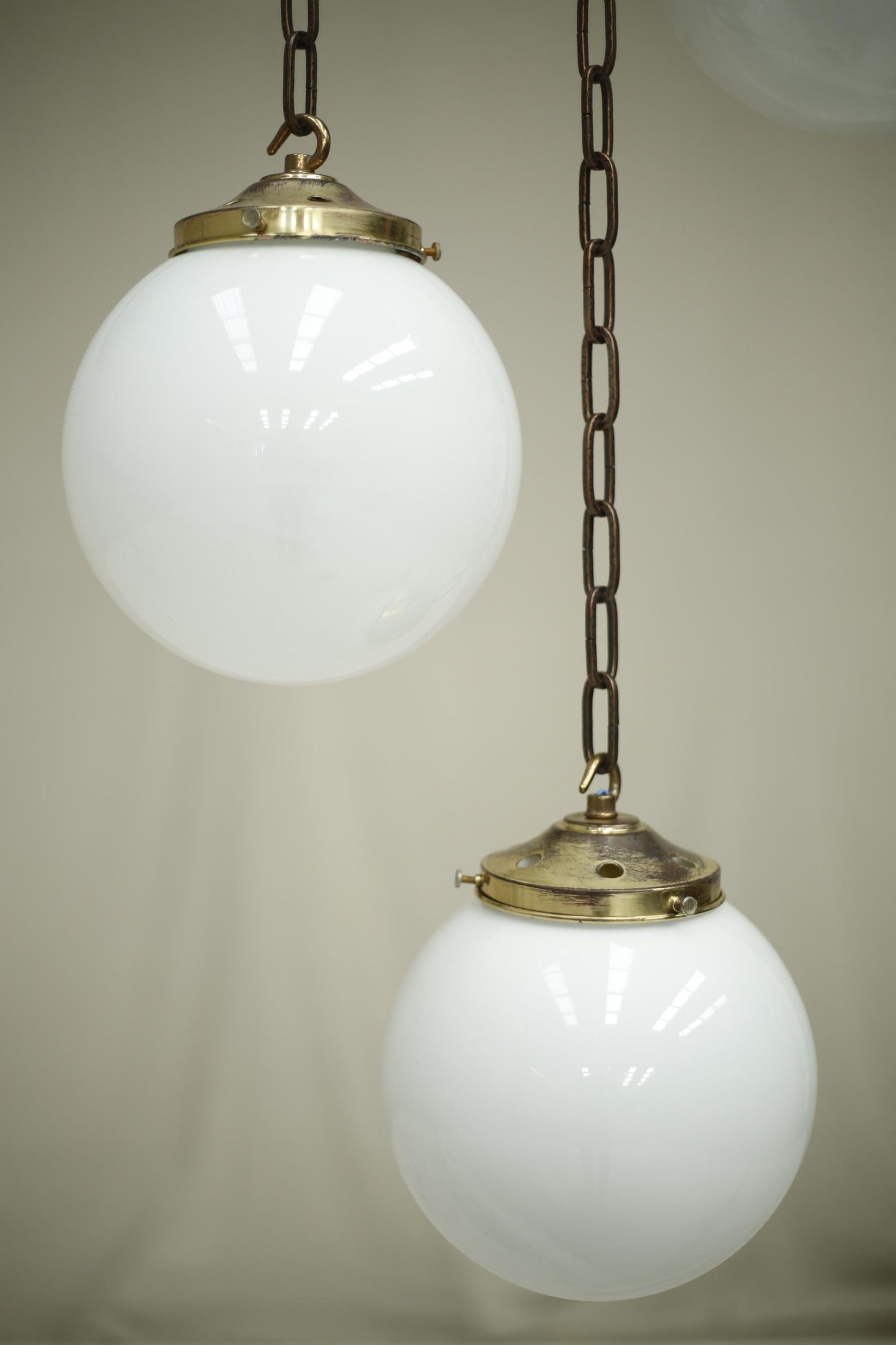 Huge run of 20th century small opaline globe pendant lights
