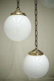 Huge run of 20th century small opaline globe pendant lights