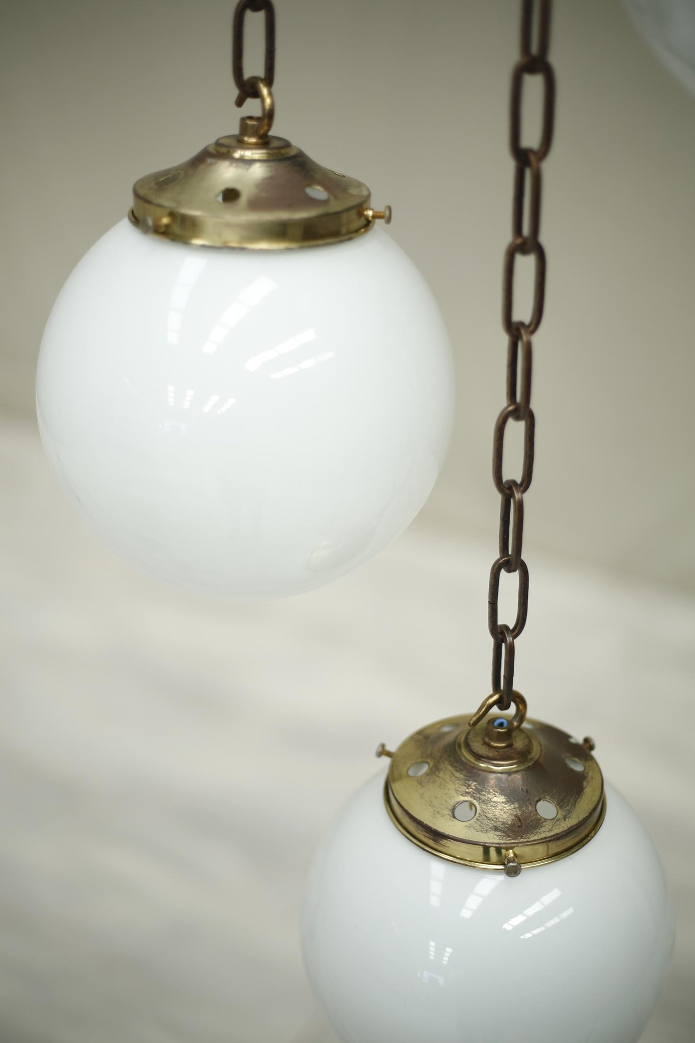 Huge run of 20th century small opaline globe pendant lights