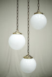 Huge run of 20th century small opaline globe pendant lights