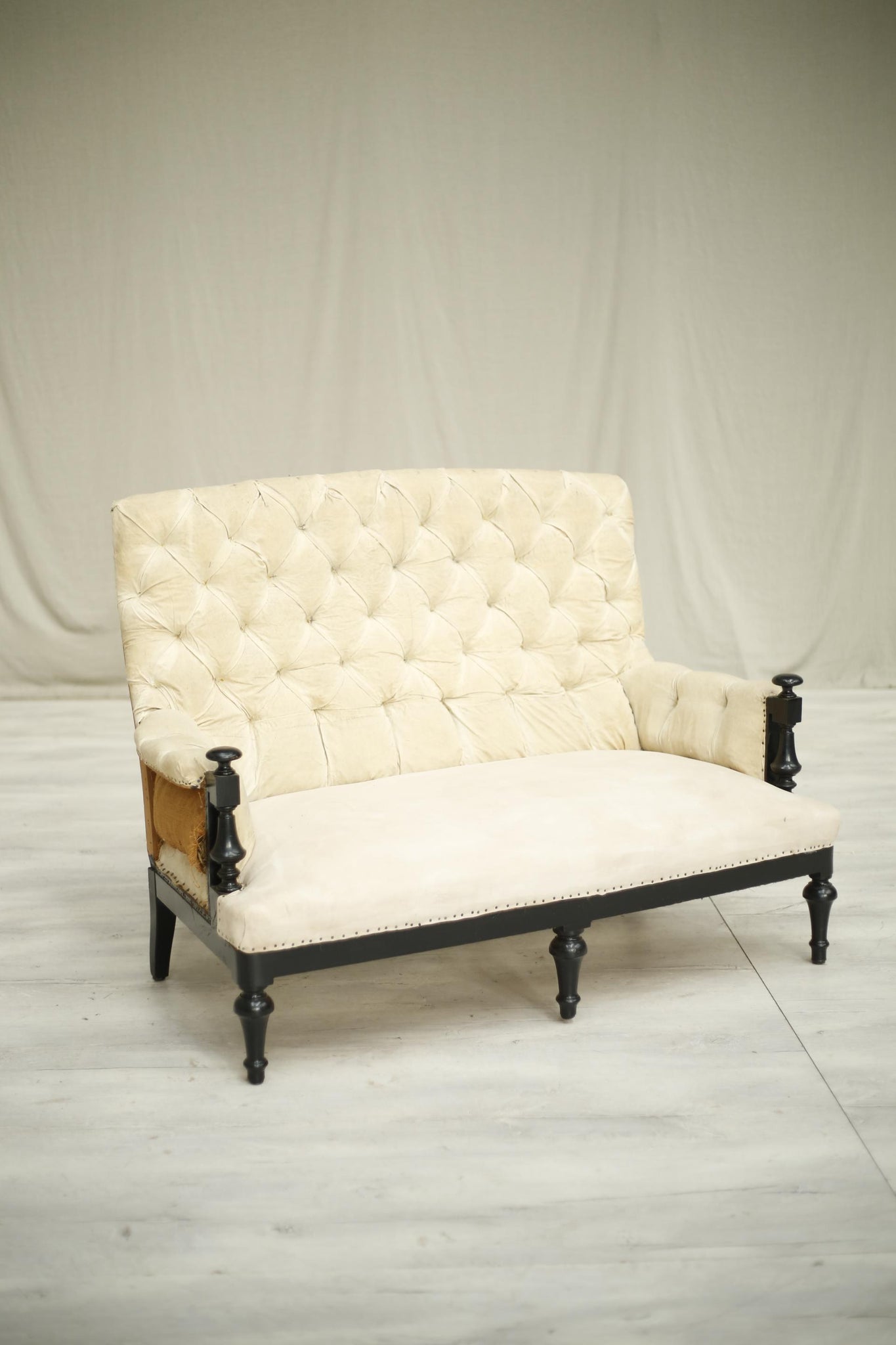 Antique Napoleon III Ebonised frame buttoned back sofa